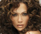 Jennifer Lopez su garbanotieji plaukai 01