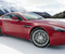 Red Aston Martin me borë
